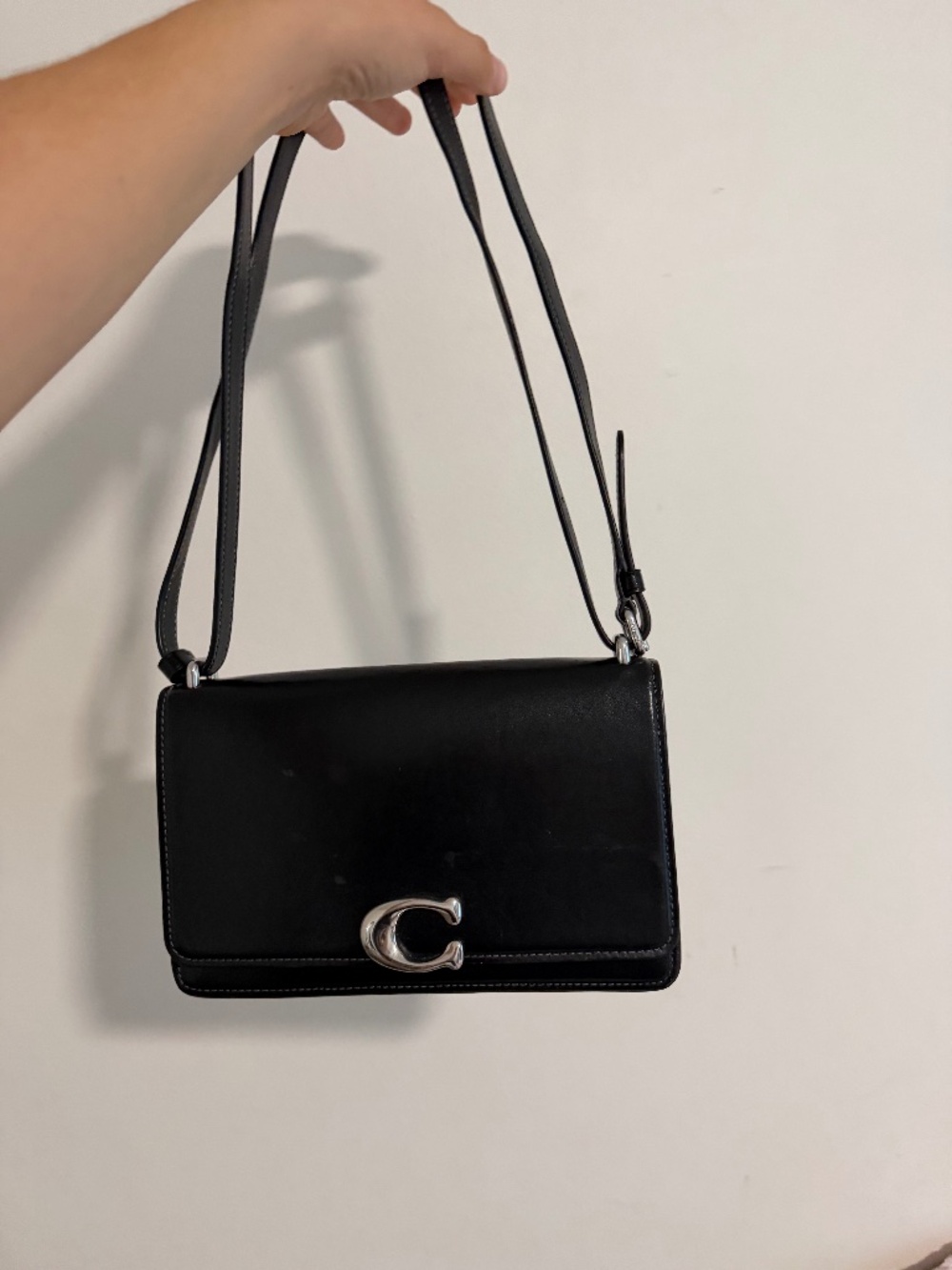 Black and silver coach purse
